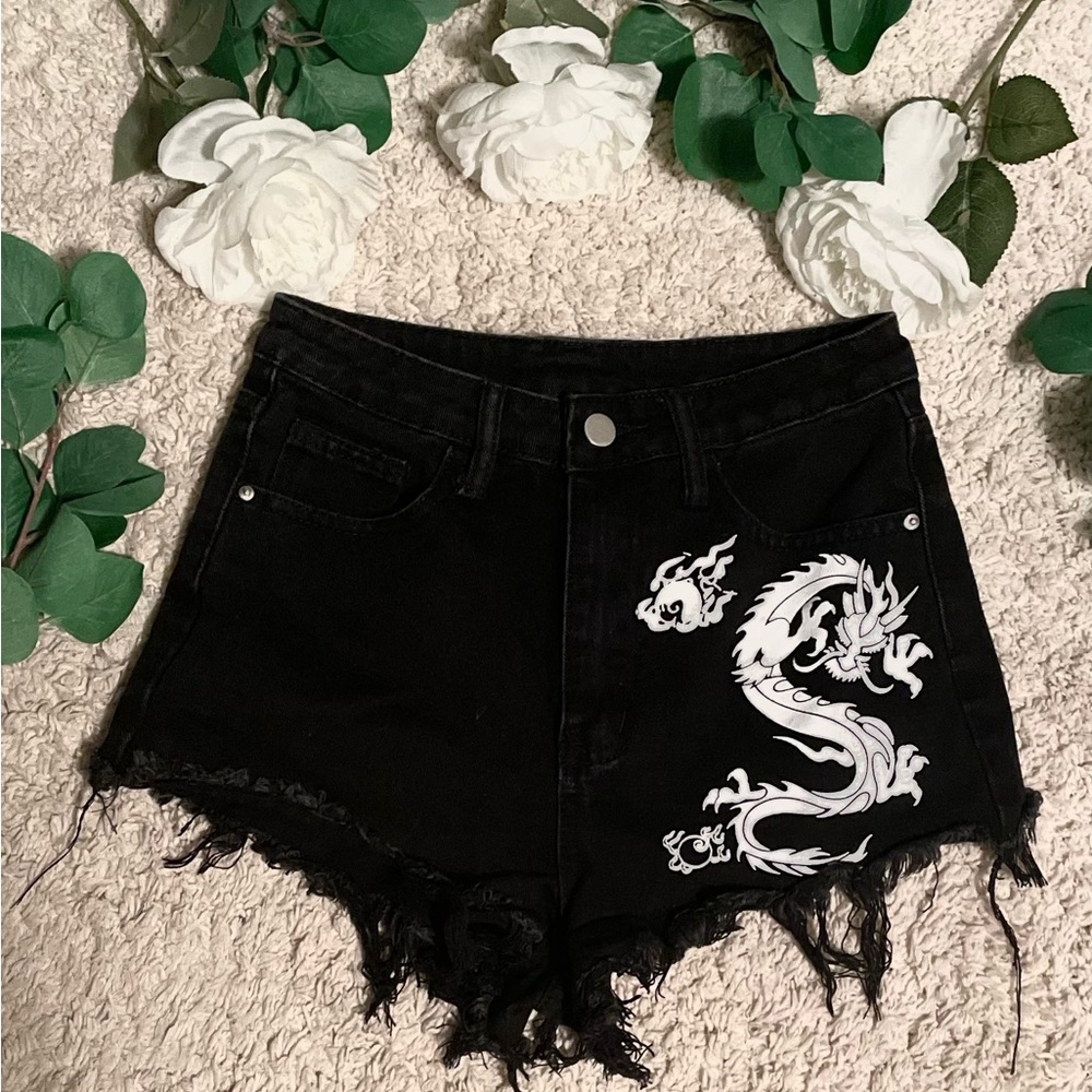 Black shorts with a dragon on one side, great condition, never worn, size 2